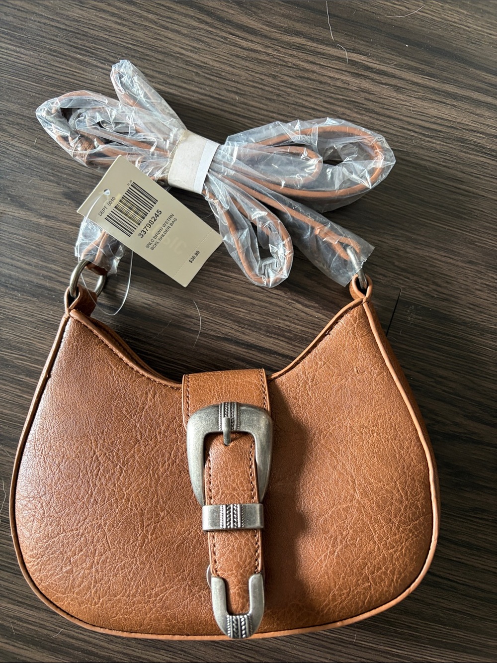 Women's Saddle Bag in Brown with Silver Buckle. Hot topic